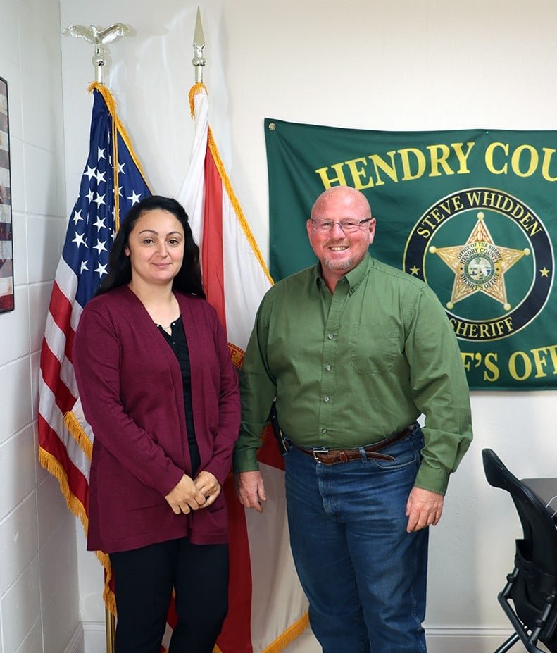 LaBELLE --  Lydia Rivera has joined Hendry County Sheriff's Office as the receptionist for the main office. At right is Sheriff Steve Whidden. [Photo courtesy HCSO]